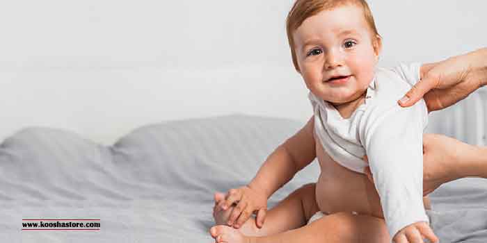 Wearing baby clothes